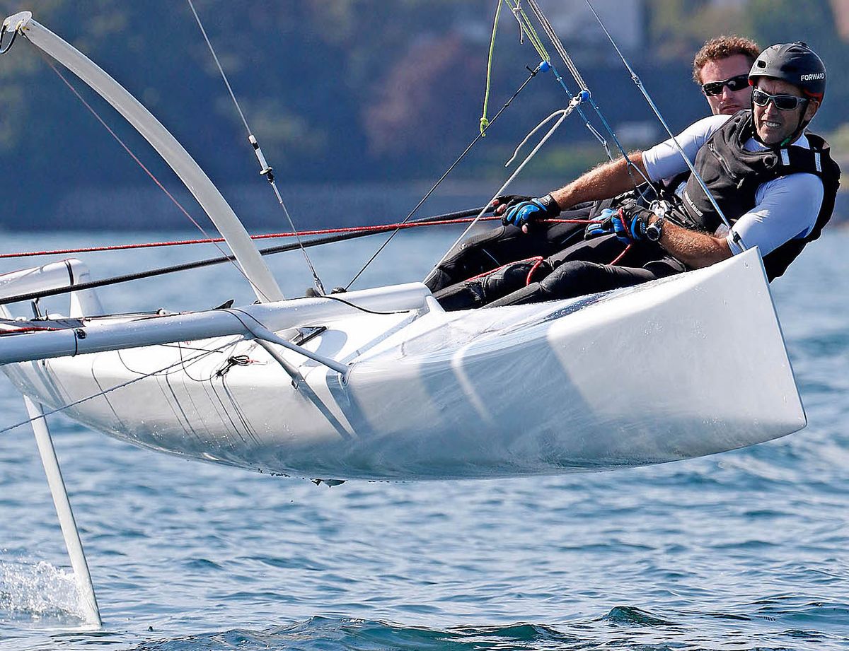 Benoît Morelle on a foiling catamaran, racing with a crew mate